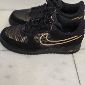 Black and Gold Nike Sneakers